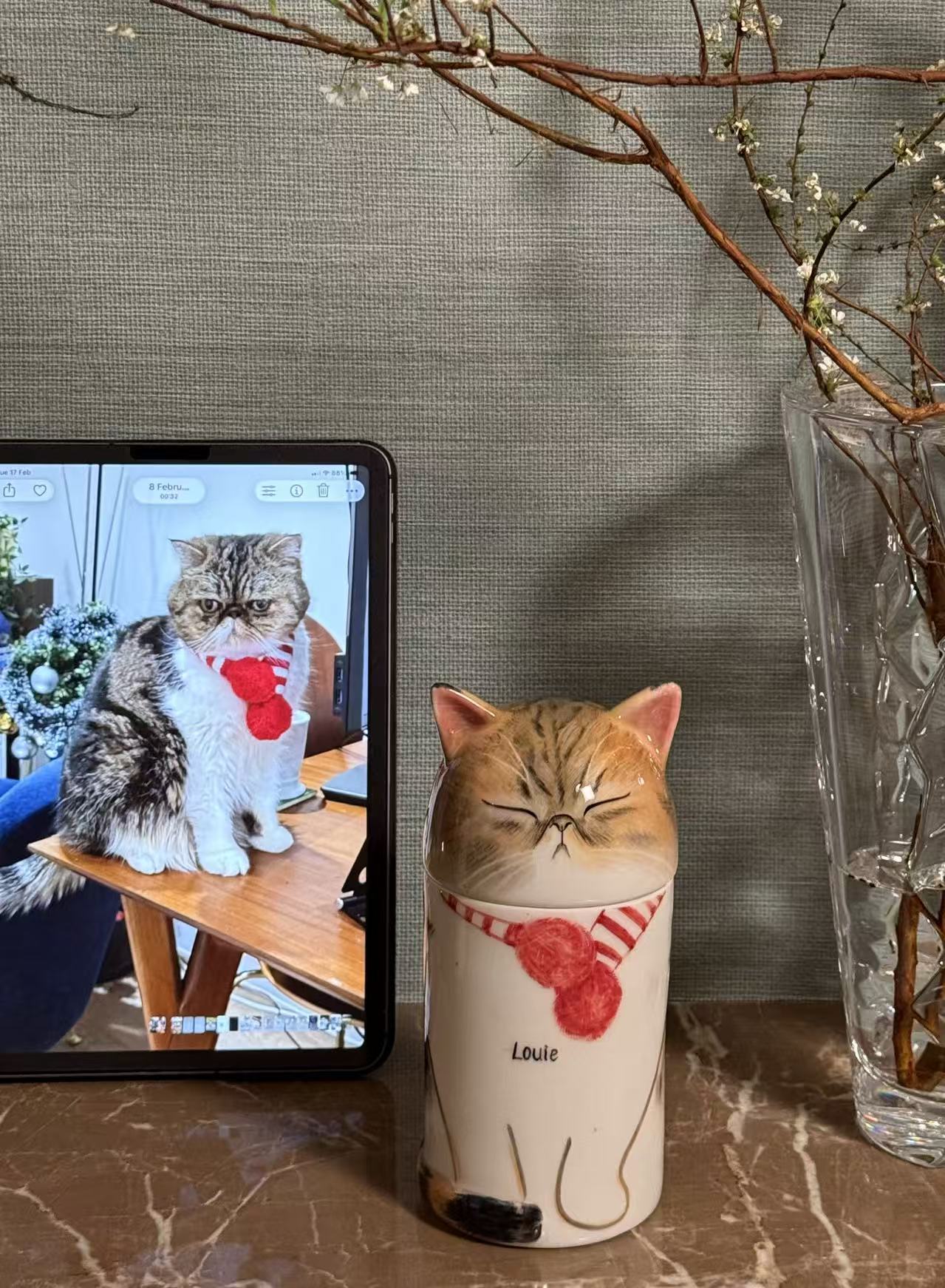 Reference photo beside a finished portrait urn