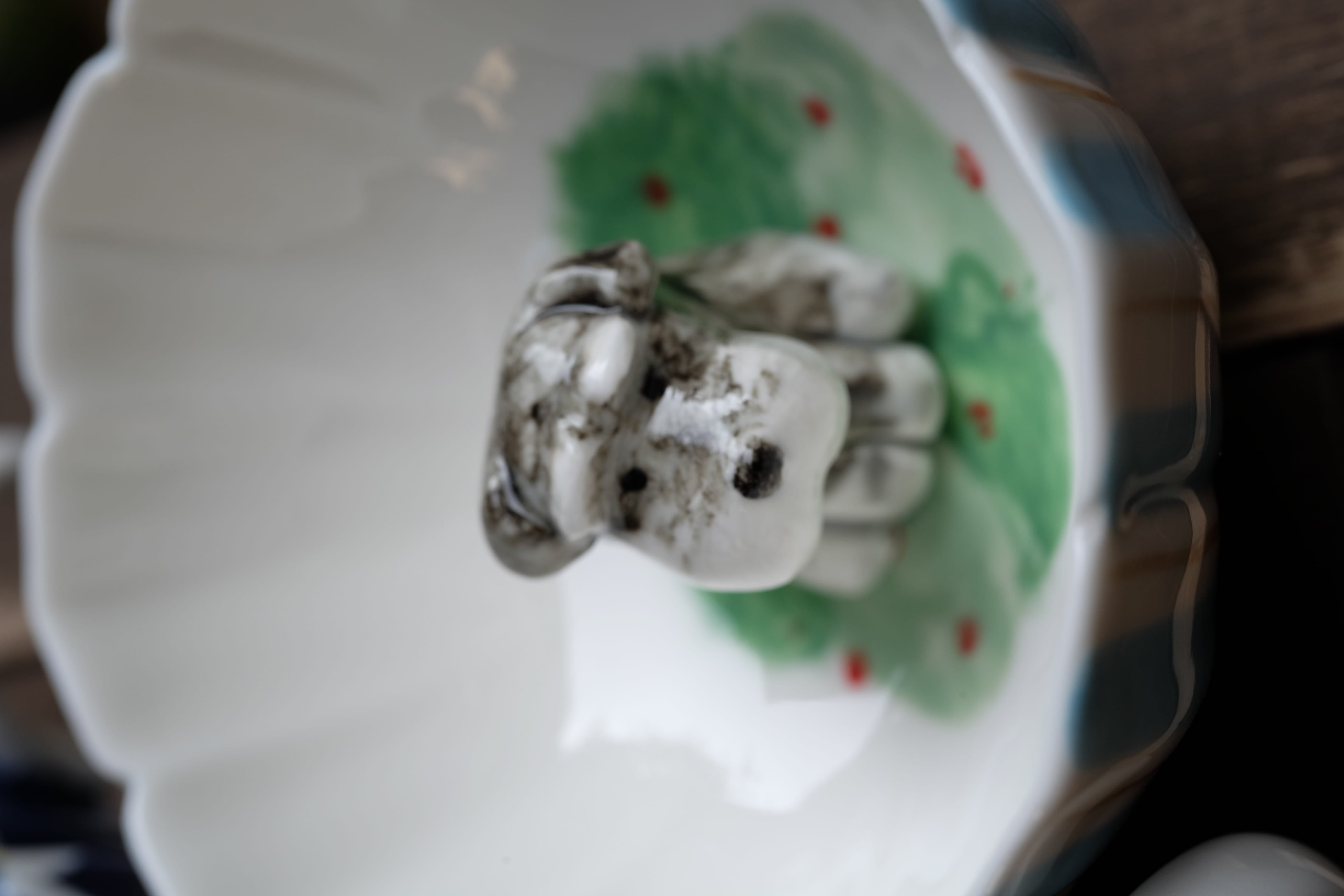 Close-up of a hand-sculpted cat figure inside an Everlou mug